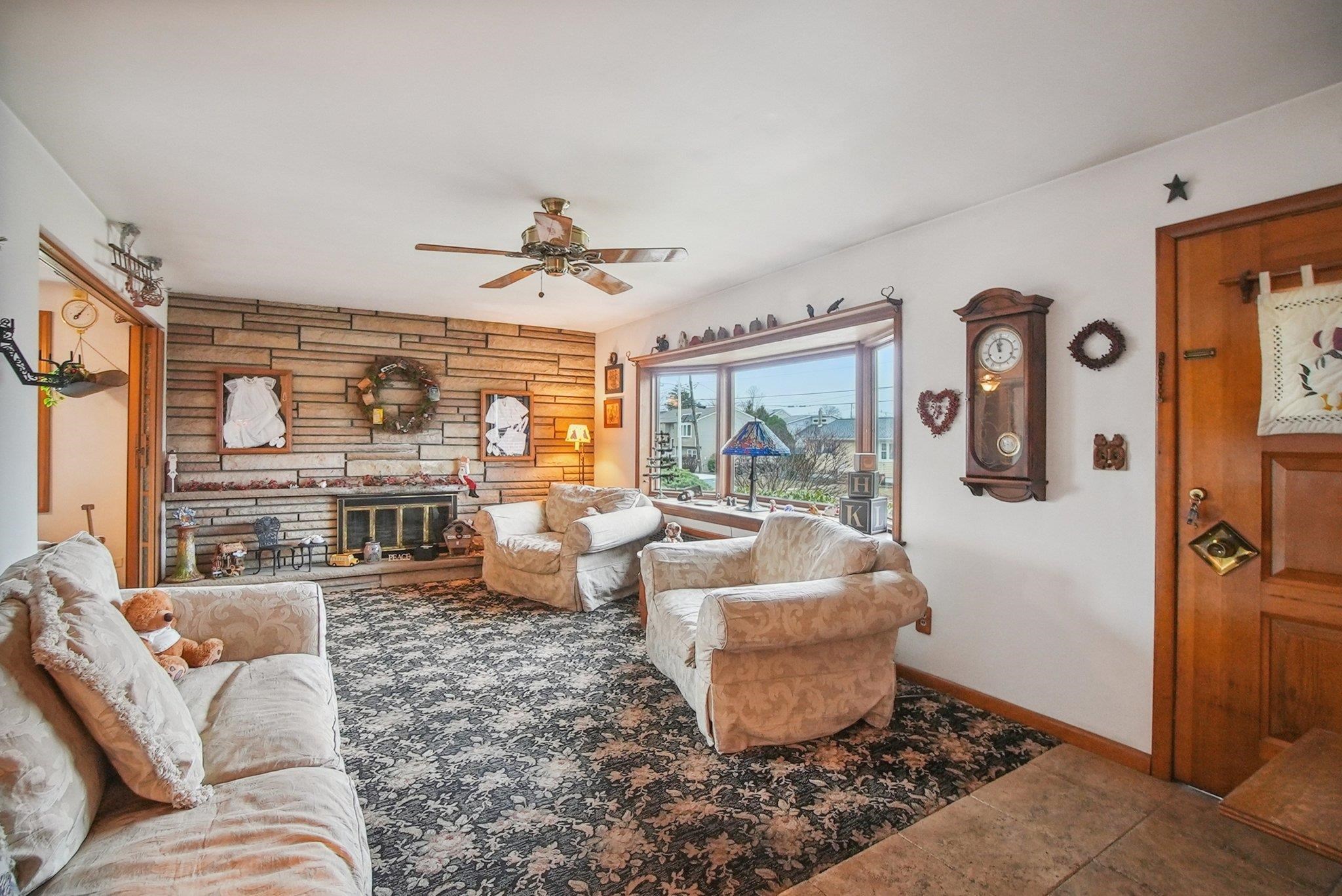 42 Frederick Street Carteret, NJ 07008 - Photo 3 of 15 a living room with furniture and a large window