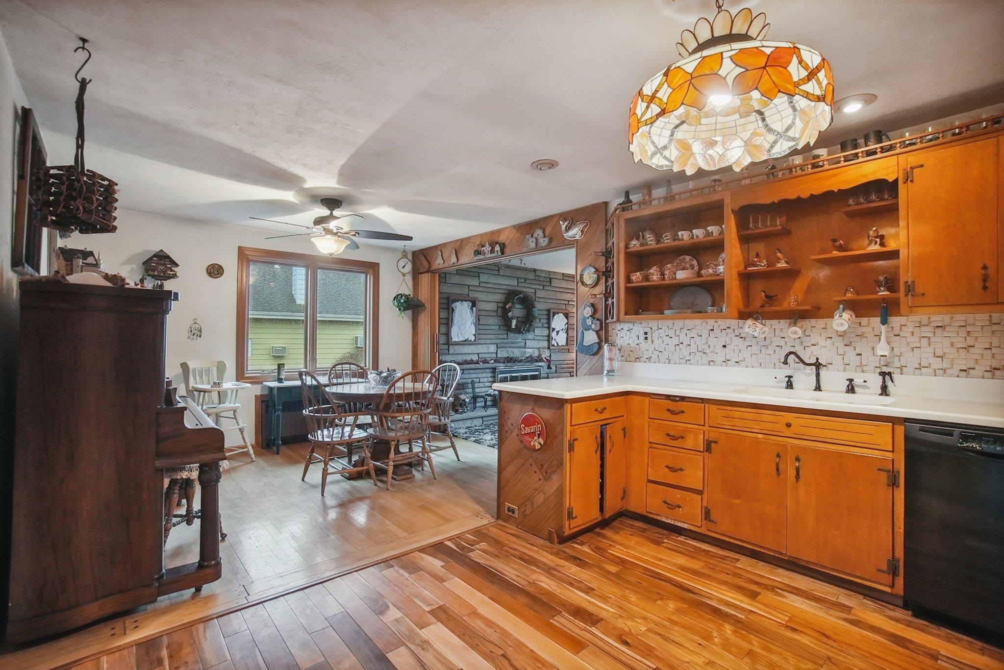 42 Frederick Street Carteret, NJ 07008 - Photo 6 of 15 a kitchen with stainless steel appliances granite countertop a sink dishwasher a stove and a refrigerator with wooden floor