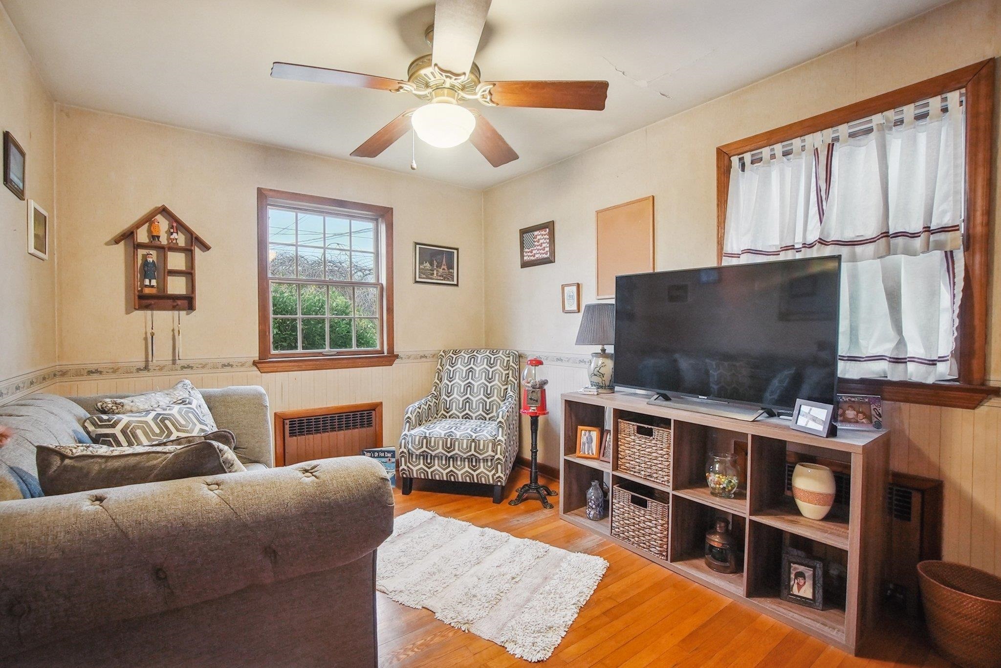 42 Frederick Street Carteret, NJ 07008 - Photo 8 of 15 a living room with furniture and a flat screen tv