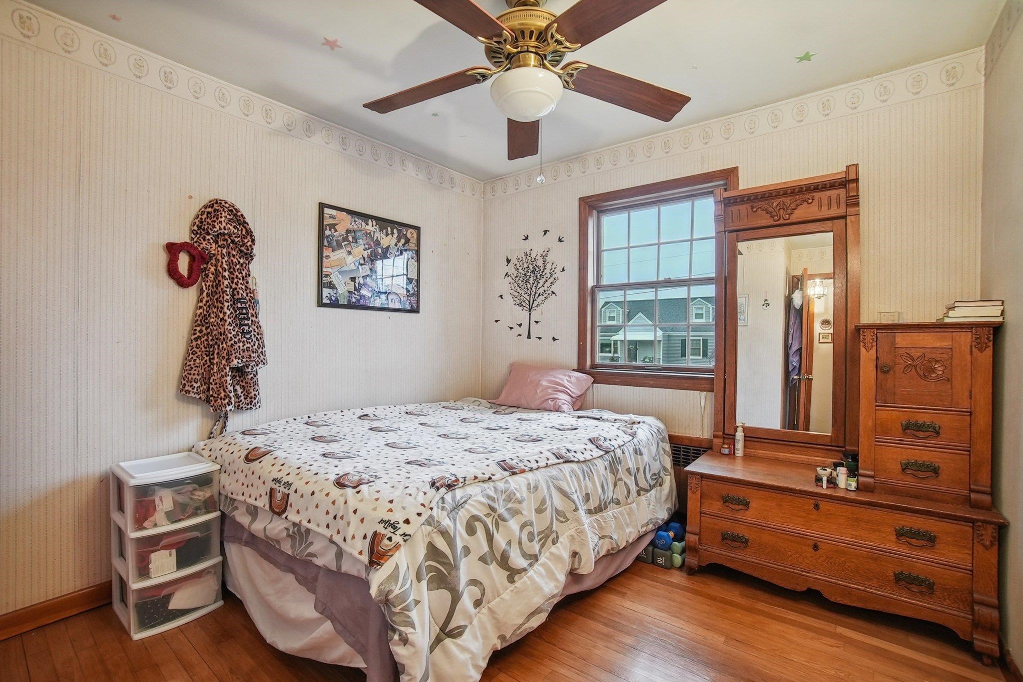 42 Frederick Street Carteret, NJ 07008 - Photo 9 of 15 a bedroom with a bed and a table