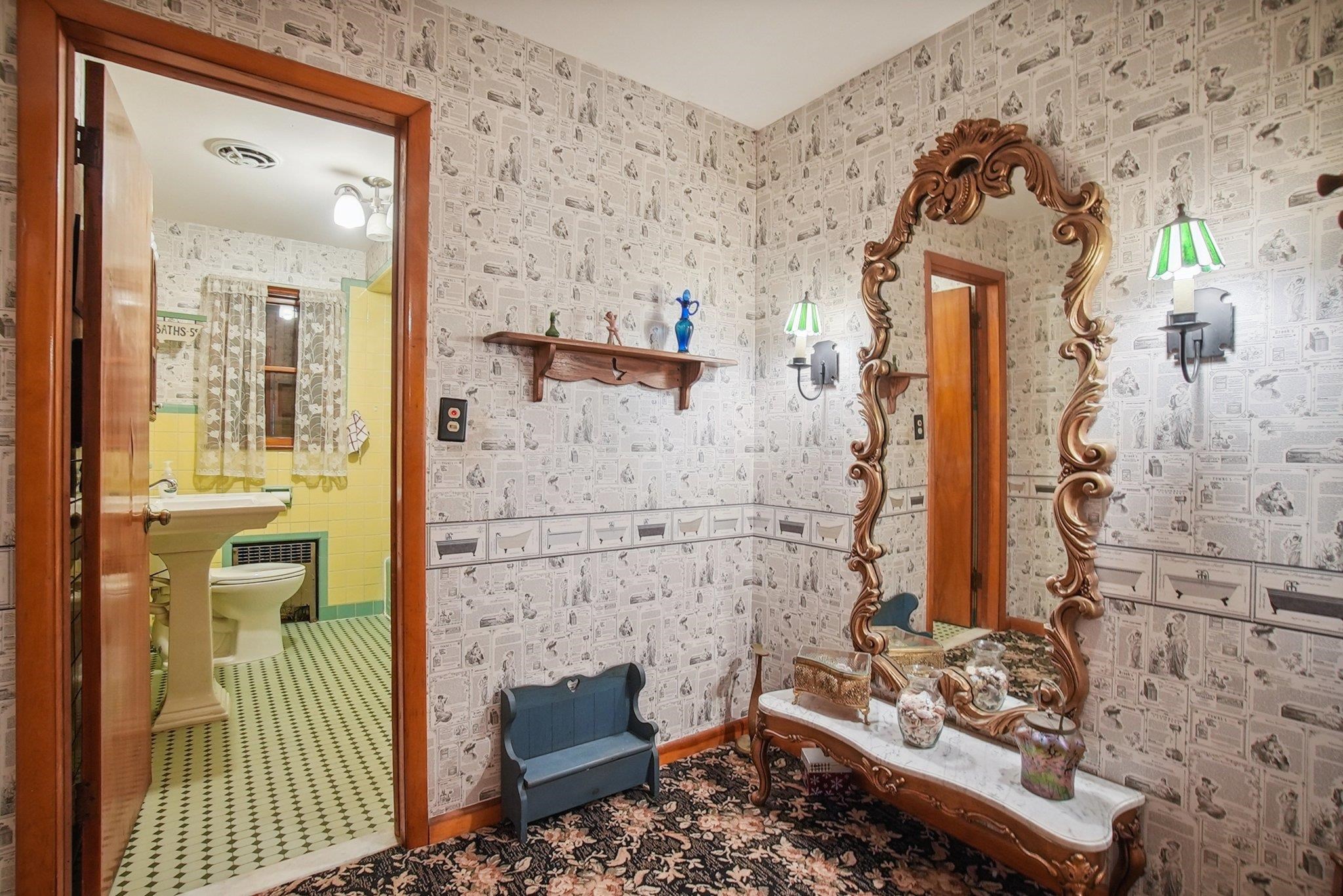 42 Frederick Street Carteret, NJ 07008 - Photo 10 of 15 en suite bathroom with a toilet sink and mirror
