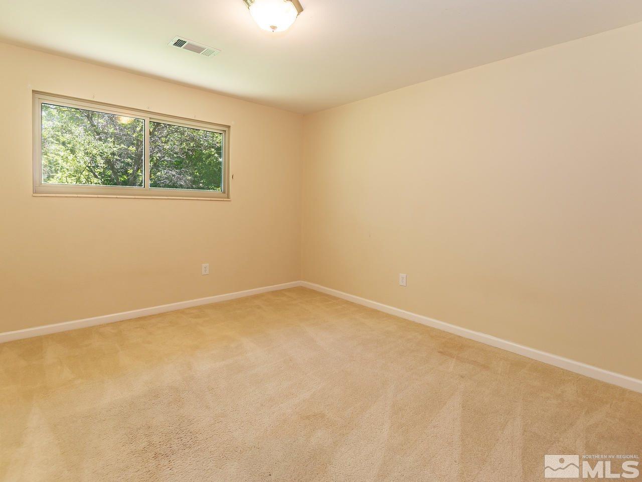 22870 Carriage Drive Reno, NV 89521 - Photo 13 of 16 an empty room with a window