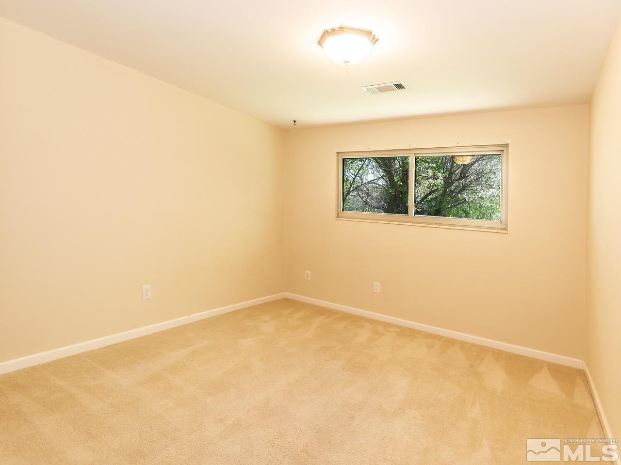 22870 Carriage Drive Reno, NV 89521 - Photo 14 of 16 an empty room with a window
