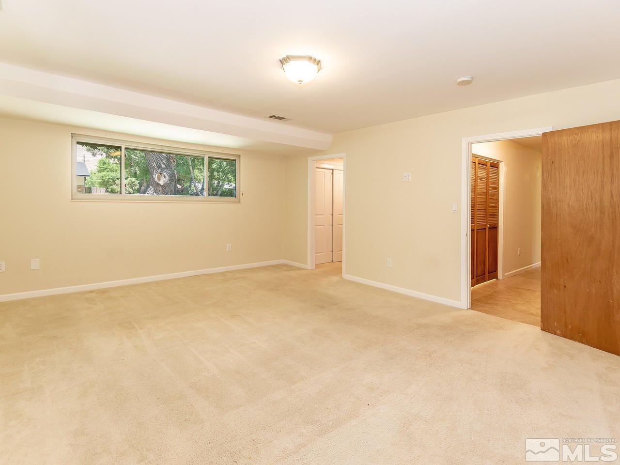 22870 Carriage Drive Reno, NV 89521 - Photo 10 of 16 an empty room with a natural light