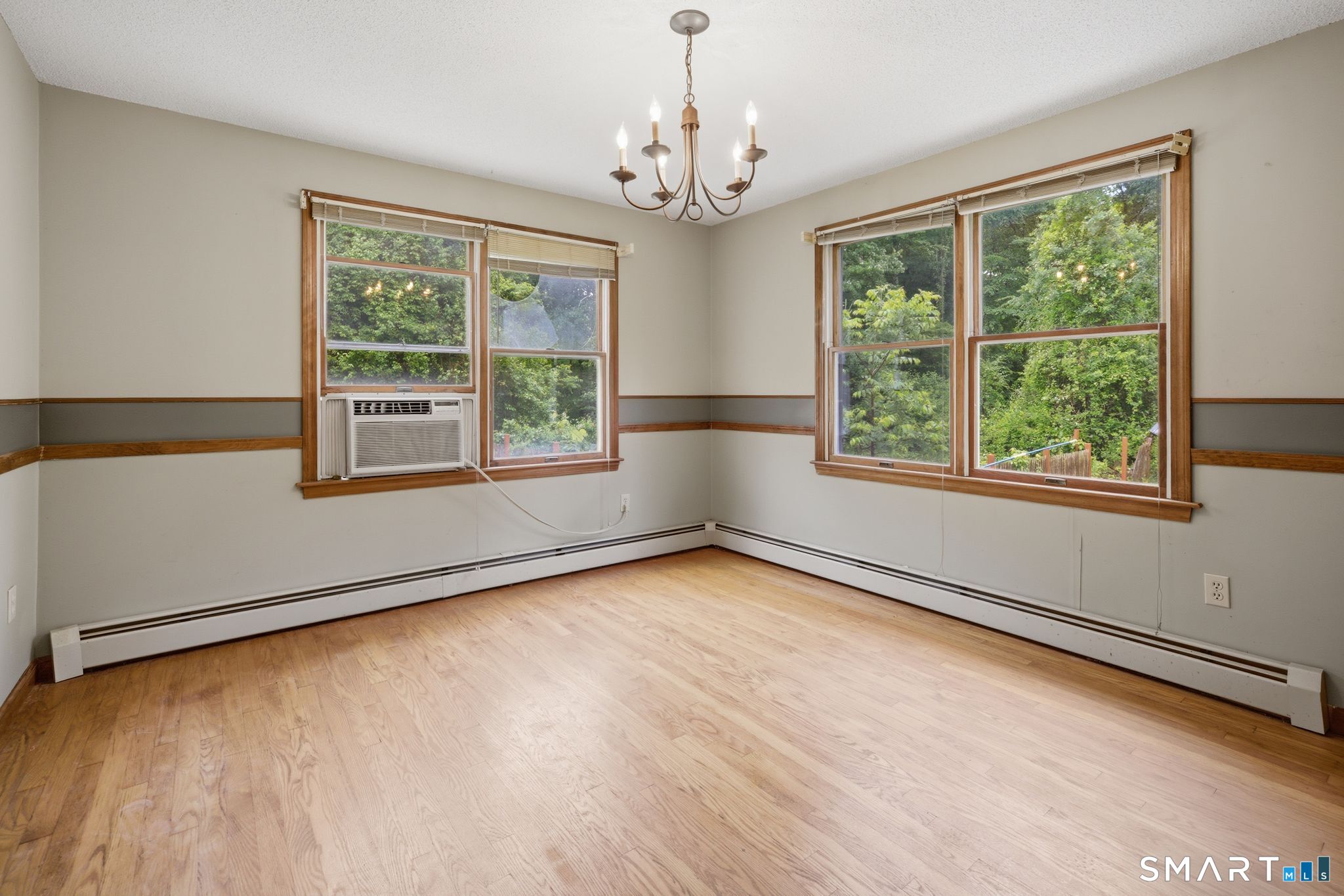 141 Hebron Road Bolton, CT 06043 - Photo 12 of 34 Generous dining area with wood flooring