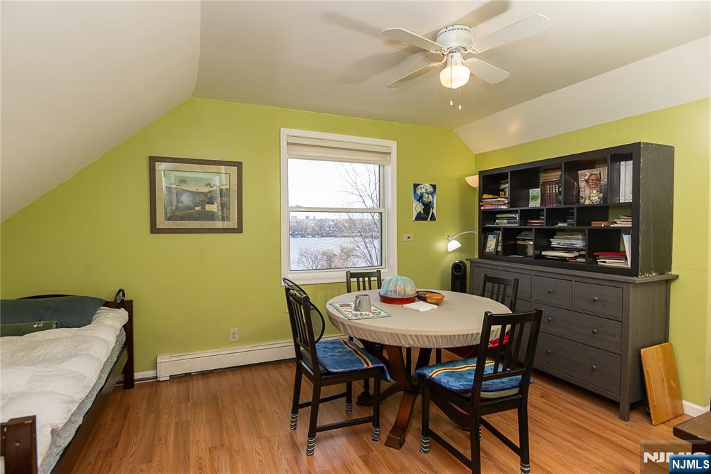 37 Riverside Avenue Little Ferry, NJ 07643 - Photo 23 of 34 a dining room with a wooden table and chairs
