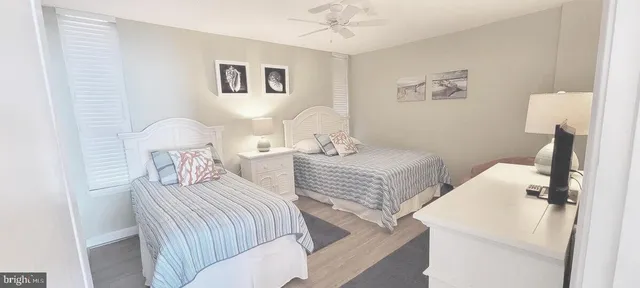 a bedroom with a bed and a table