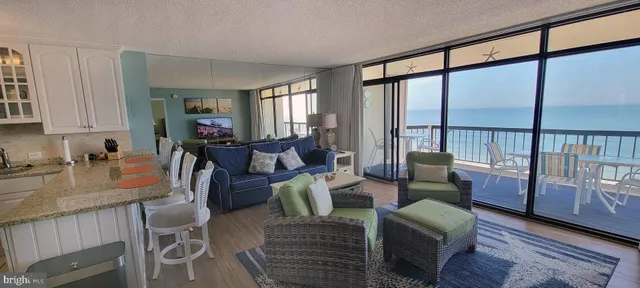 a living room with furniture a fireplace and a window