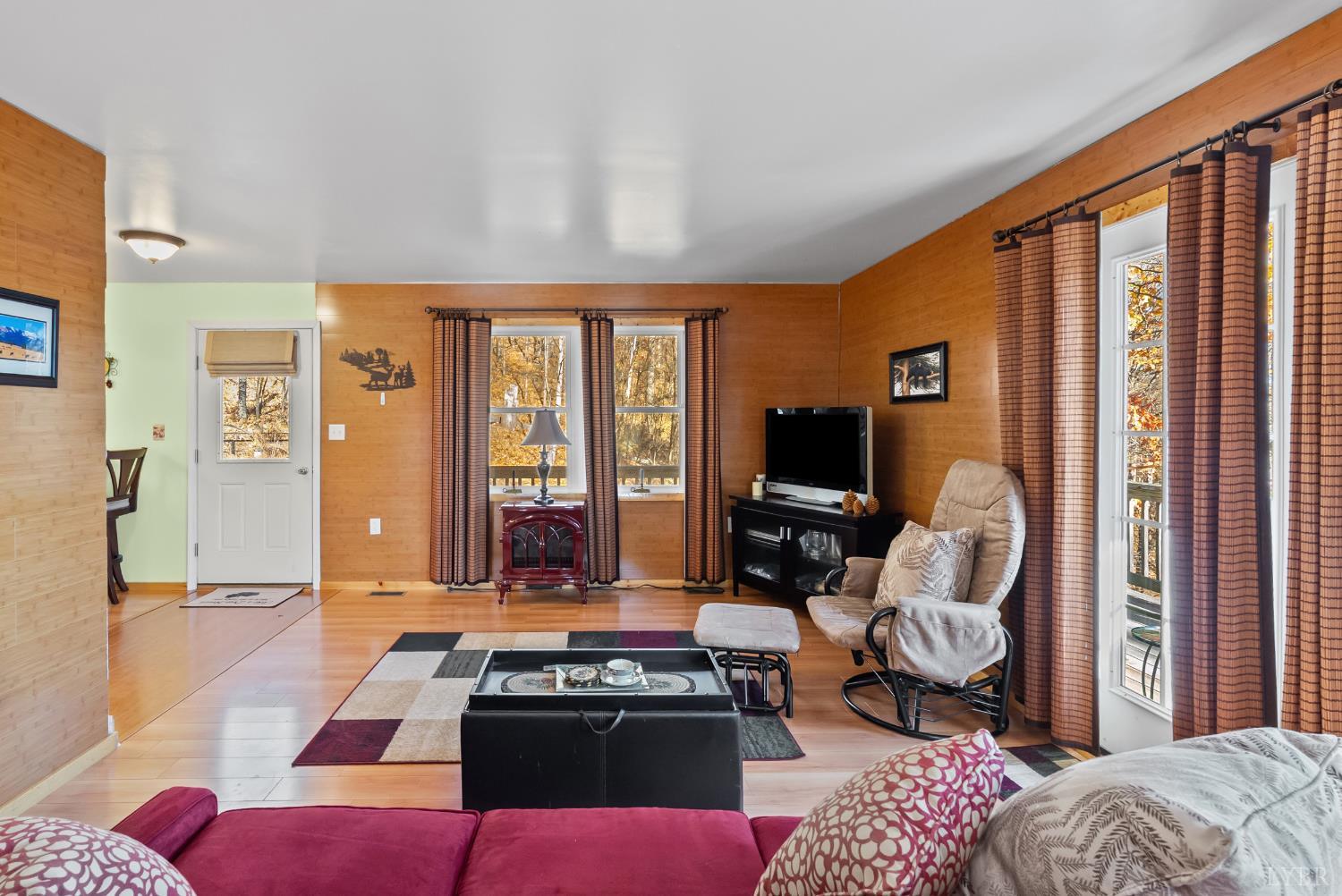 371 Hawks Nest Road Monroe, VA 24574 - Photo 11 of 51 a bedroom with furniture and a flat screen tv