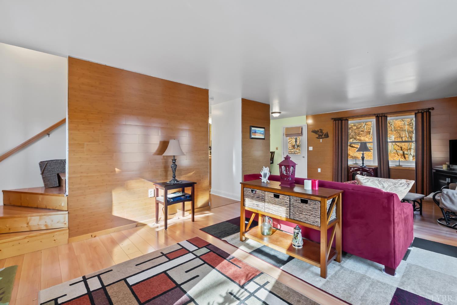 371 Hawks Nest Road Monroe, VA 24574 - Photo 13 of 51 a living room with furniture and a floor to ceiling window