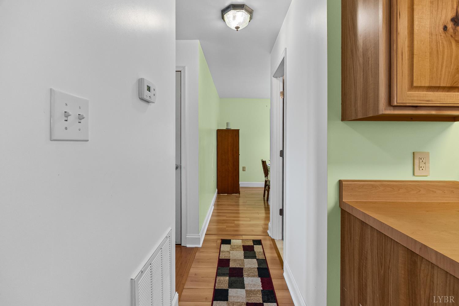 371 Hawks Nest Road Monroe, VA 24574 - Photo 16 of 51 a view of a hallway with wooden floor and staircase