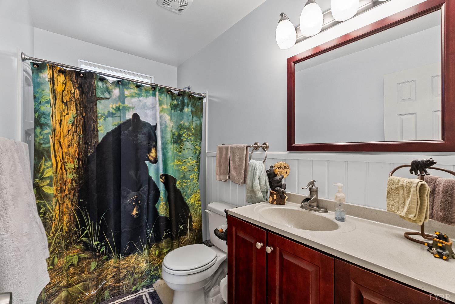 371 Hawks Nest Road Monroe, VA 24574 - Photo 17 of 51 a bathroom with a granite countertop sink toilet and mirror