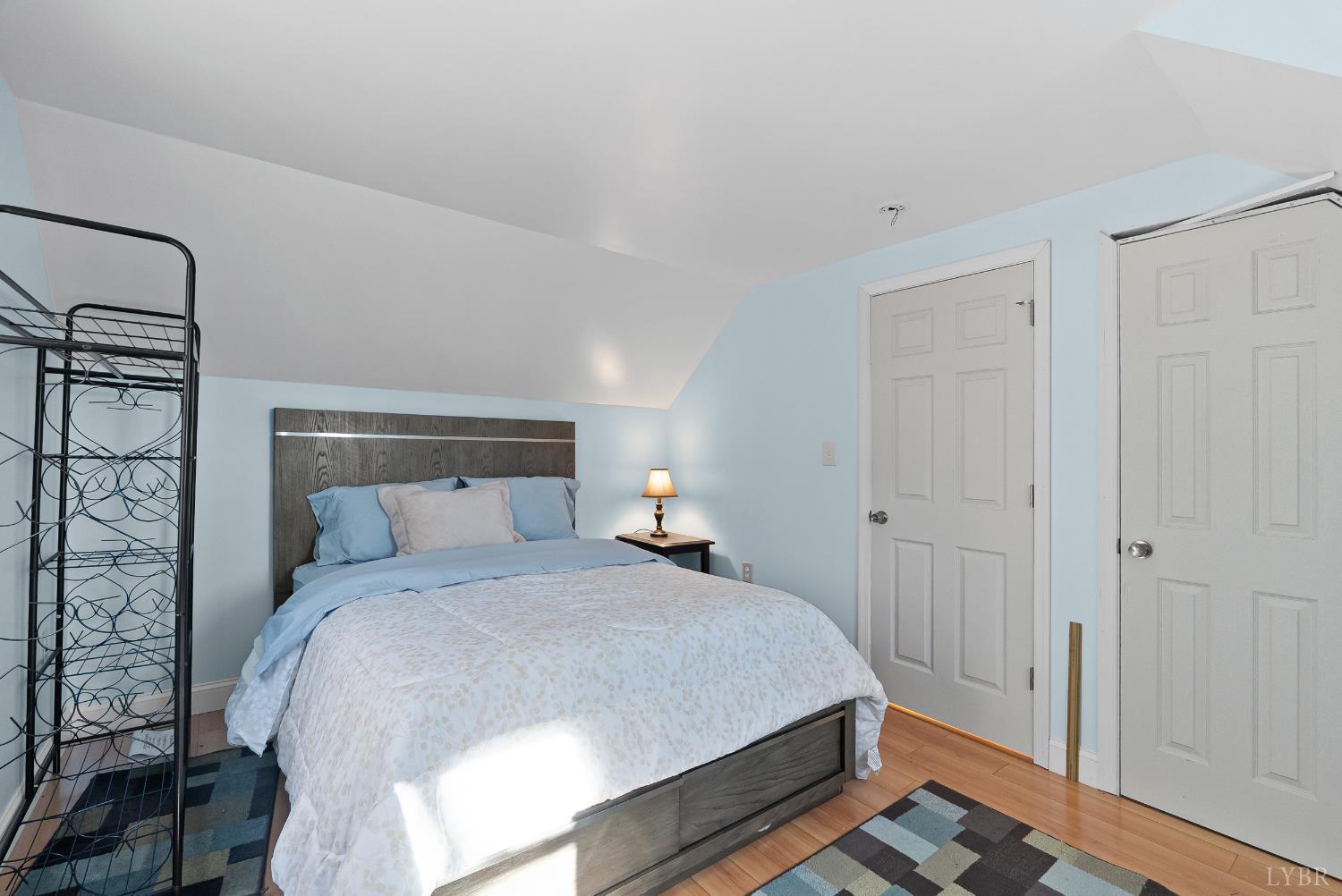 371 Hawks Nest Road Monroe, VA 24574 - Photo 29 of 51 a bedroom with a bed and a mirror