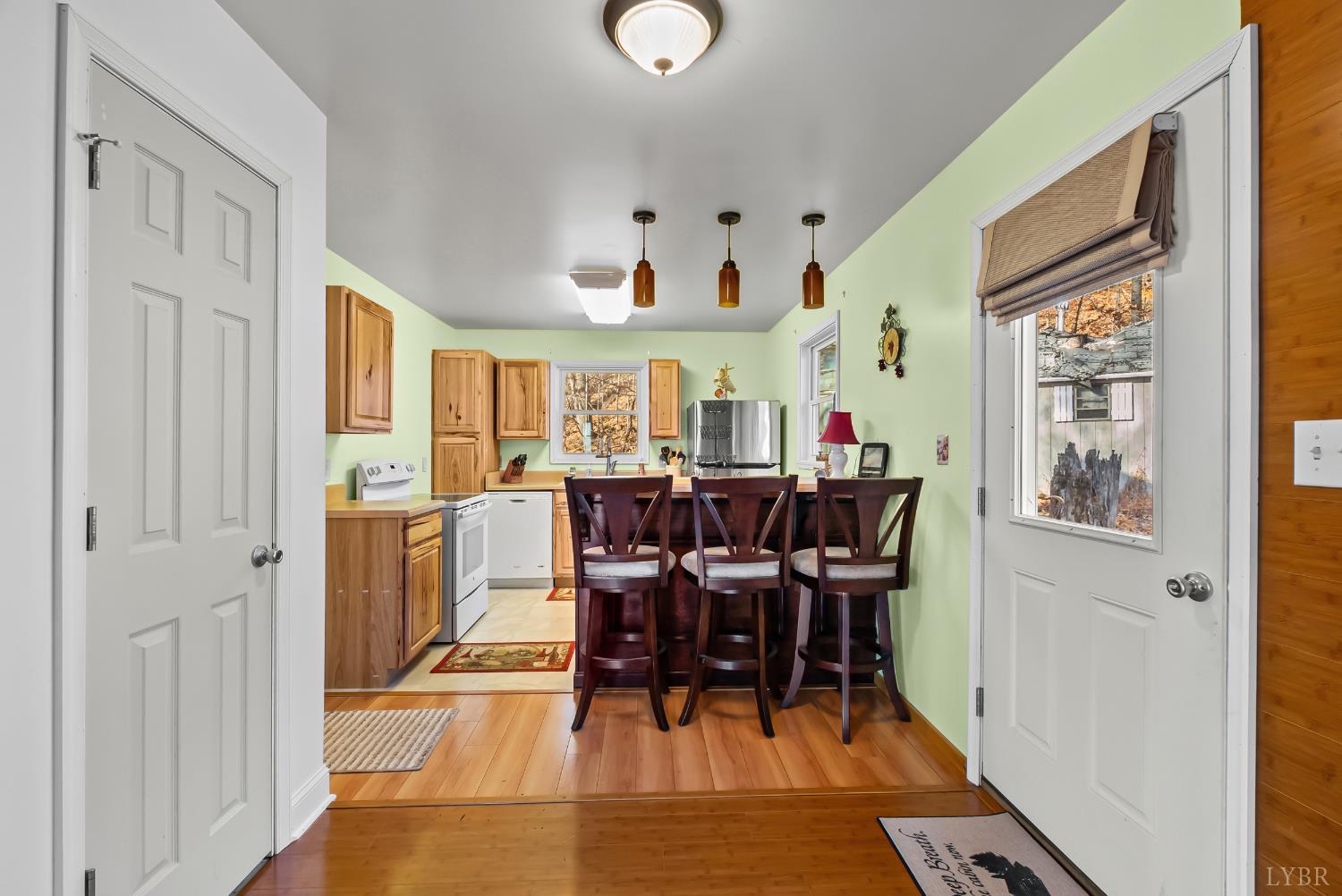 371 Hawks Nest Road Monroe, VA 24574 - Photo 3 of 51 a view of a dining room with furniture and chandelier