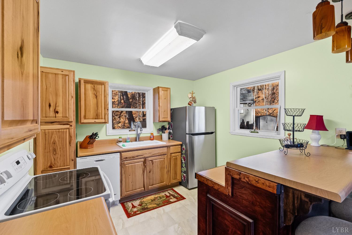 371 Hawks Nest Road Monroe, VA 24574 - Photo 4 of 51 a kitchen that has a sink and a refrigerator