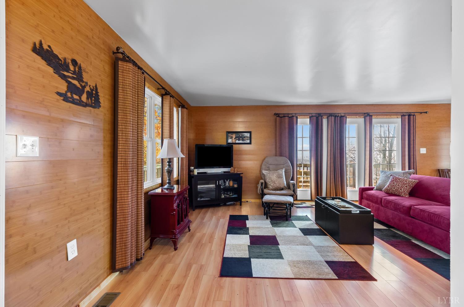 371 Hawks Nest Road Monroe, VA 24574 - Photo 9 of 51 a living room with furniture fireplace and a large window