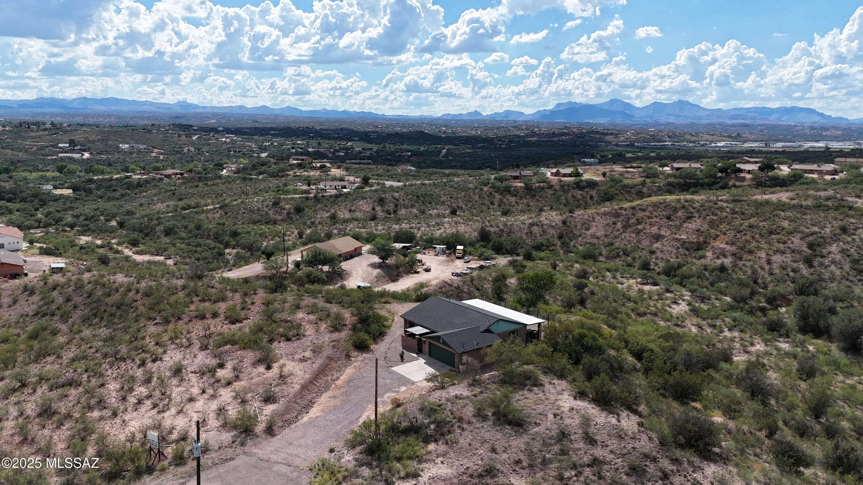 995 Jar Court Rio Rico, AZ 85648 - Photo 40 of 44 an aerial view of a house with a yard