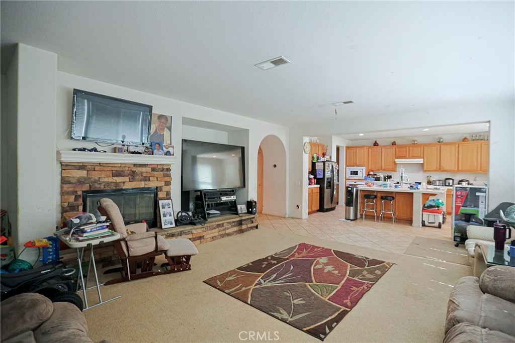 12657 Burbank Road Eastvale, CA 92880 - Photo 7 of 10 Kitchen& Living Room