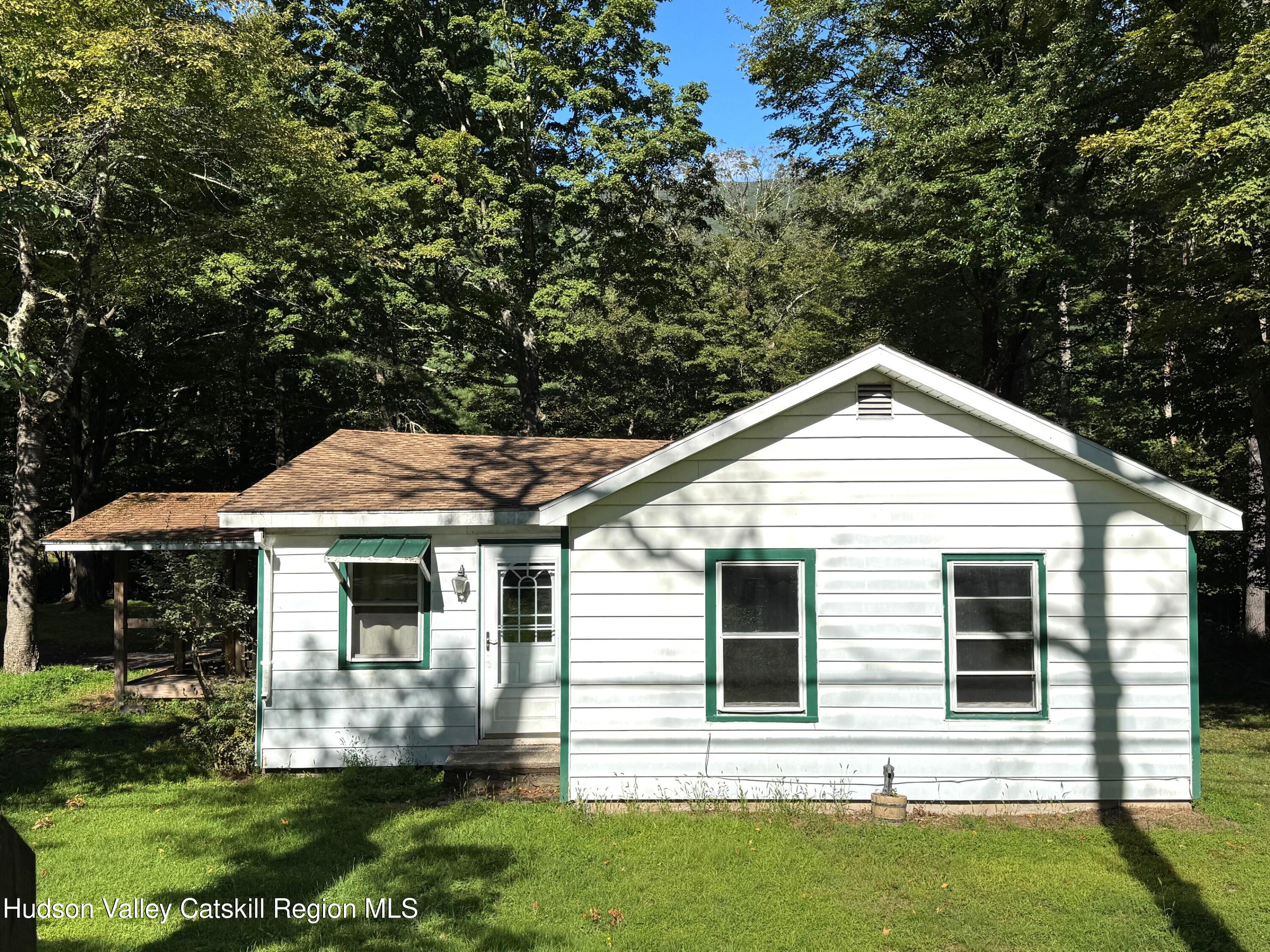 573 Manorville Road Saugerties, NY 12477 - Photo 2 of 16 a front view of a house with a yard