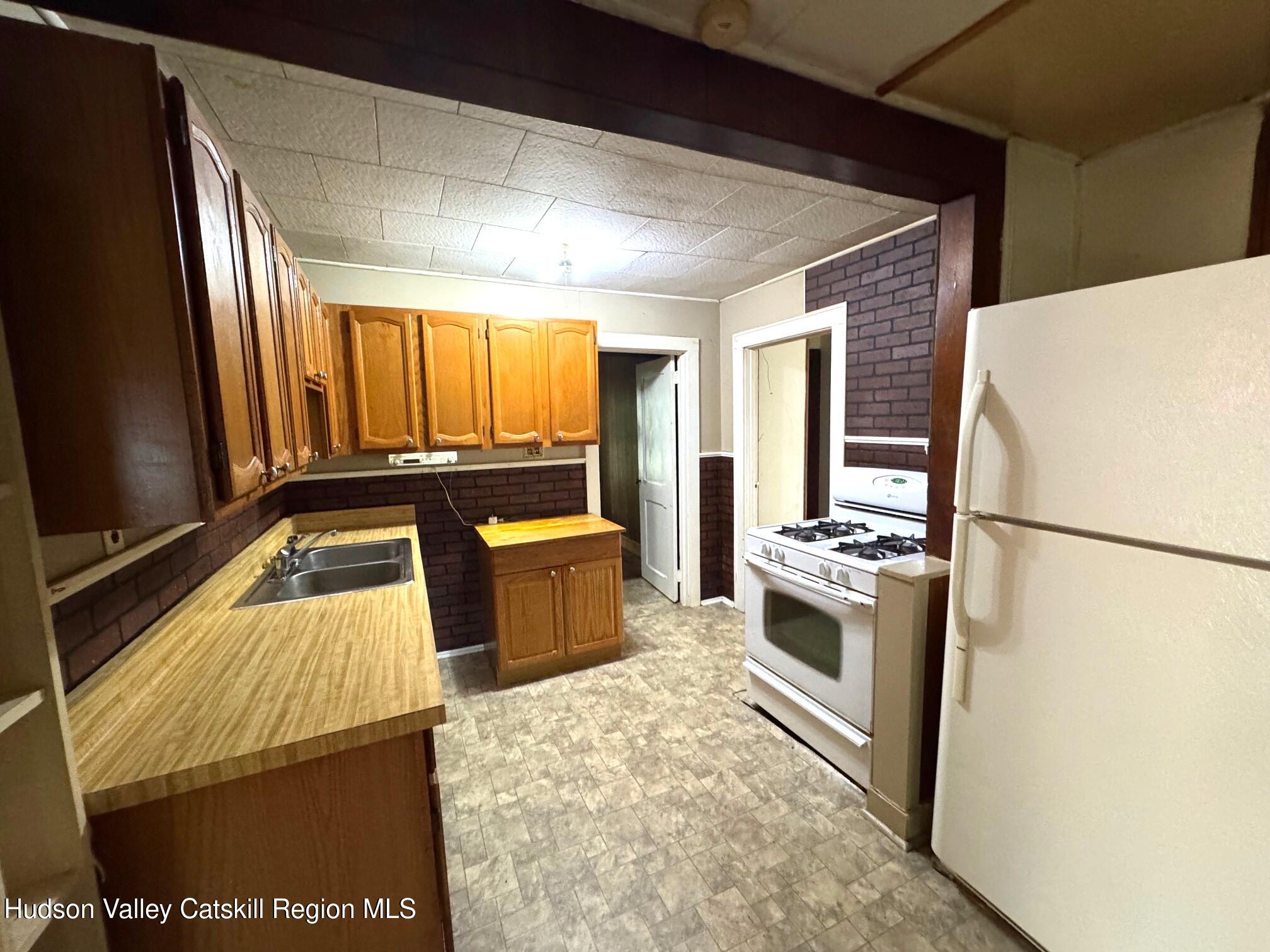 573 Manorville Road Saugerties, NY 12477 - Photo 3 of 16 a kitchen with stainless steel appliances granite countertop a refrigerator a stove and a sink