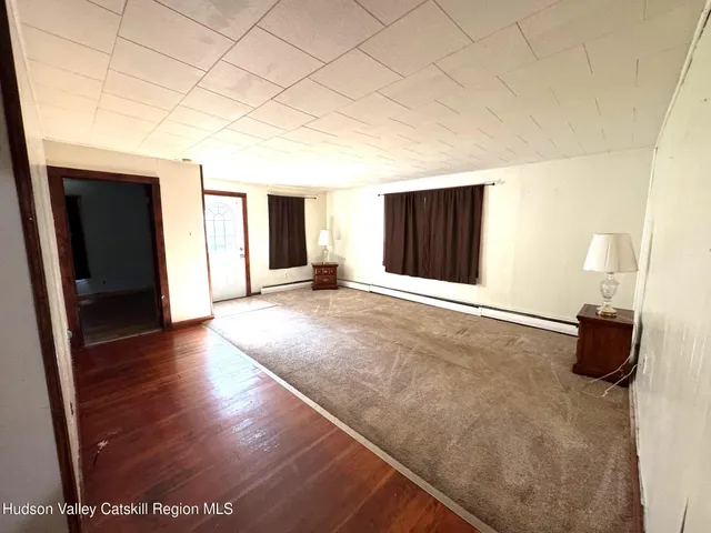 a view of a livingroom with wooden floor