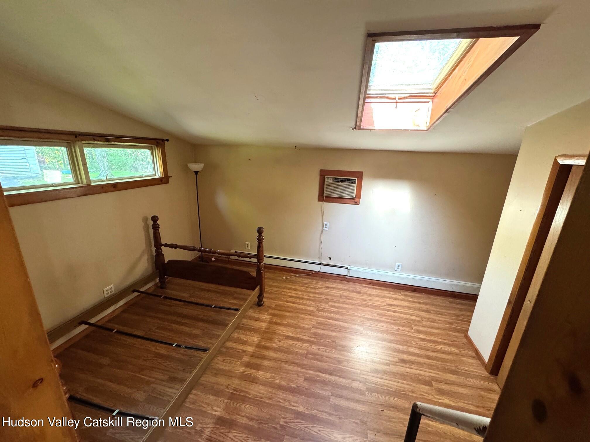 573 Manorville Road Saugerties, NY 12477 - Photo 7 of 16 a view of empty room with wooden floor and fan