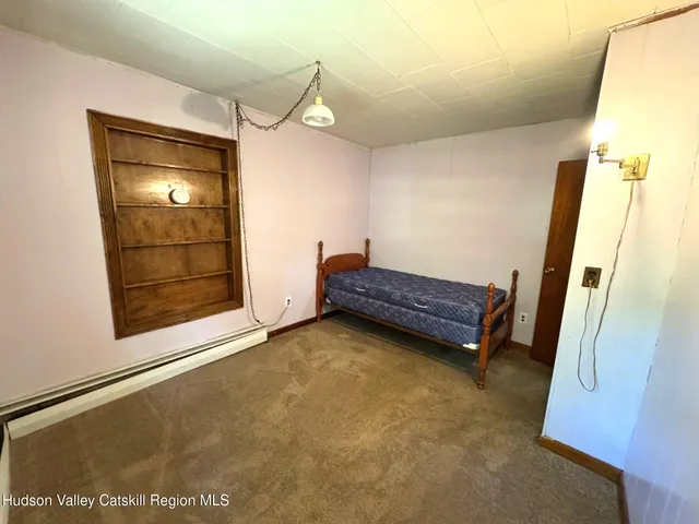 a view of room with window and hardwood floor