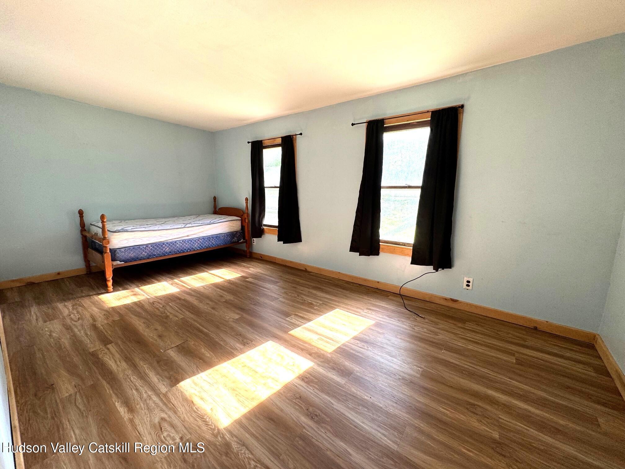 573 Manorville Road Saugerties, NY 12477 - Photo 10 of 16 a view of room with window and hardwood floor