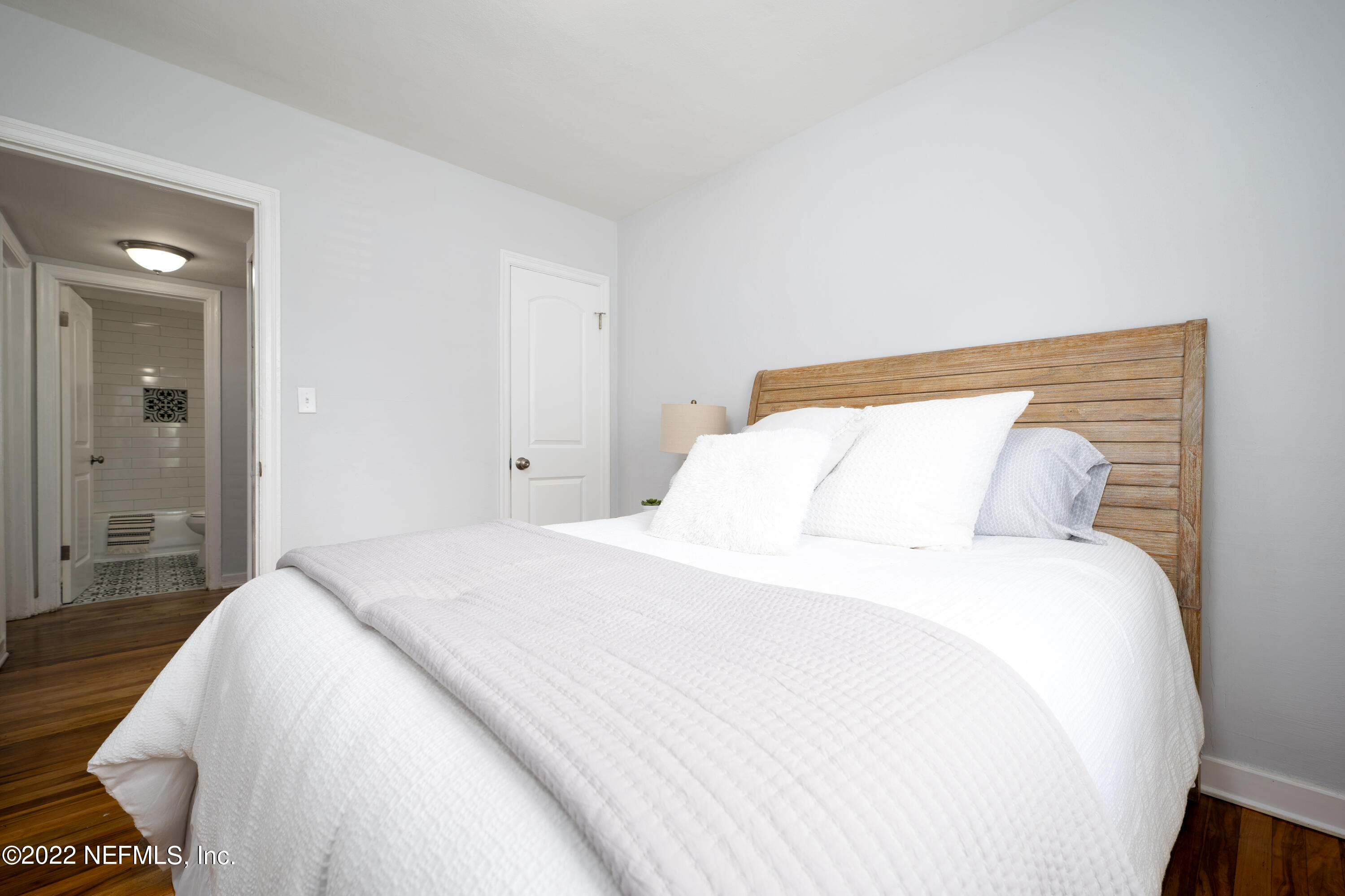 1368 Rensselaer Avenue Jacksonville, FL 32205 - Photo 18 of 48 a bedroom with a bed and a night stand