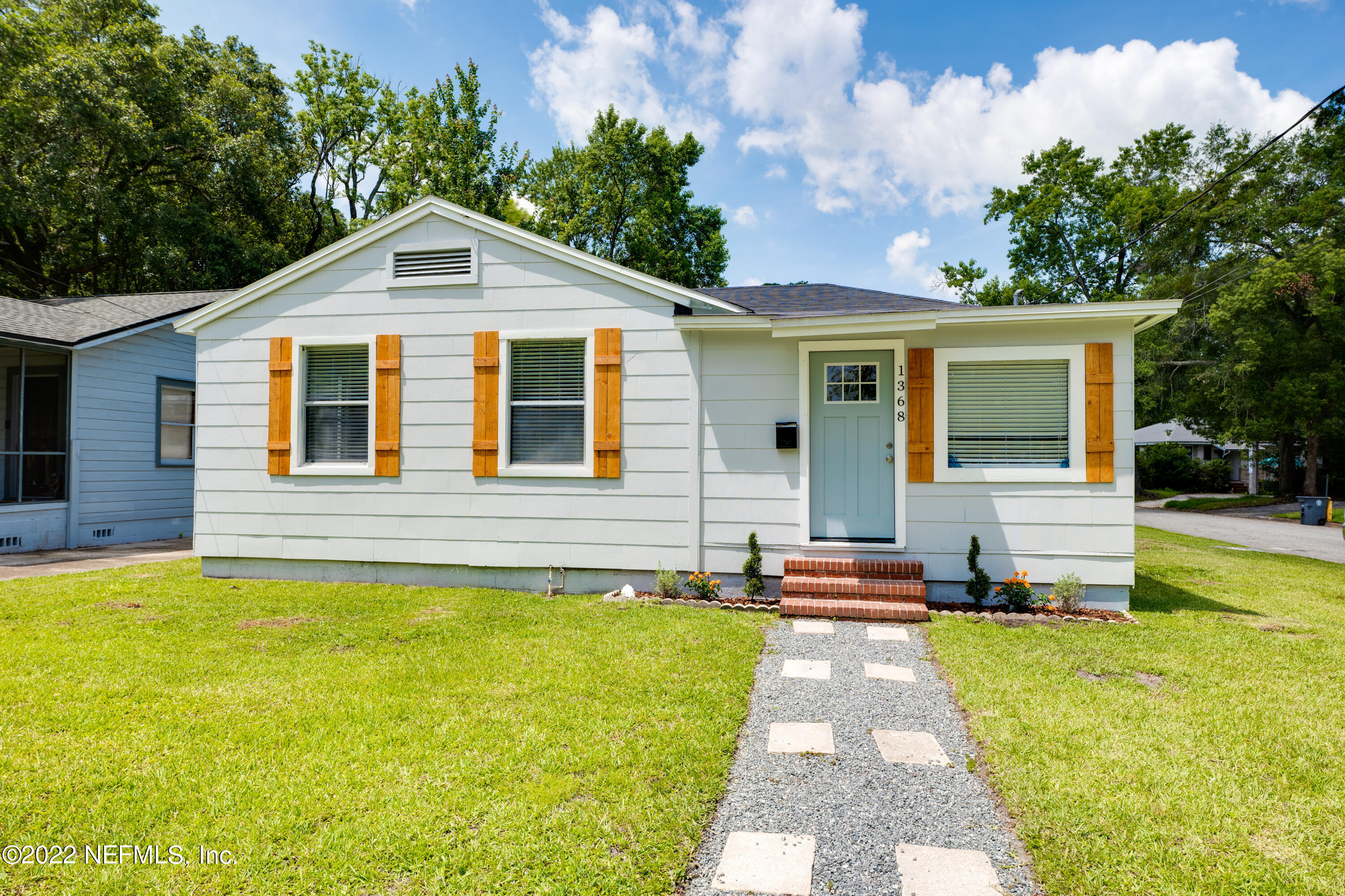 1368 Rensselaer Avenue Jacksonville, FL 32205 - Photo 2 of 48 a front view of a house with a yard