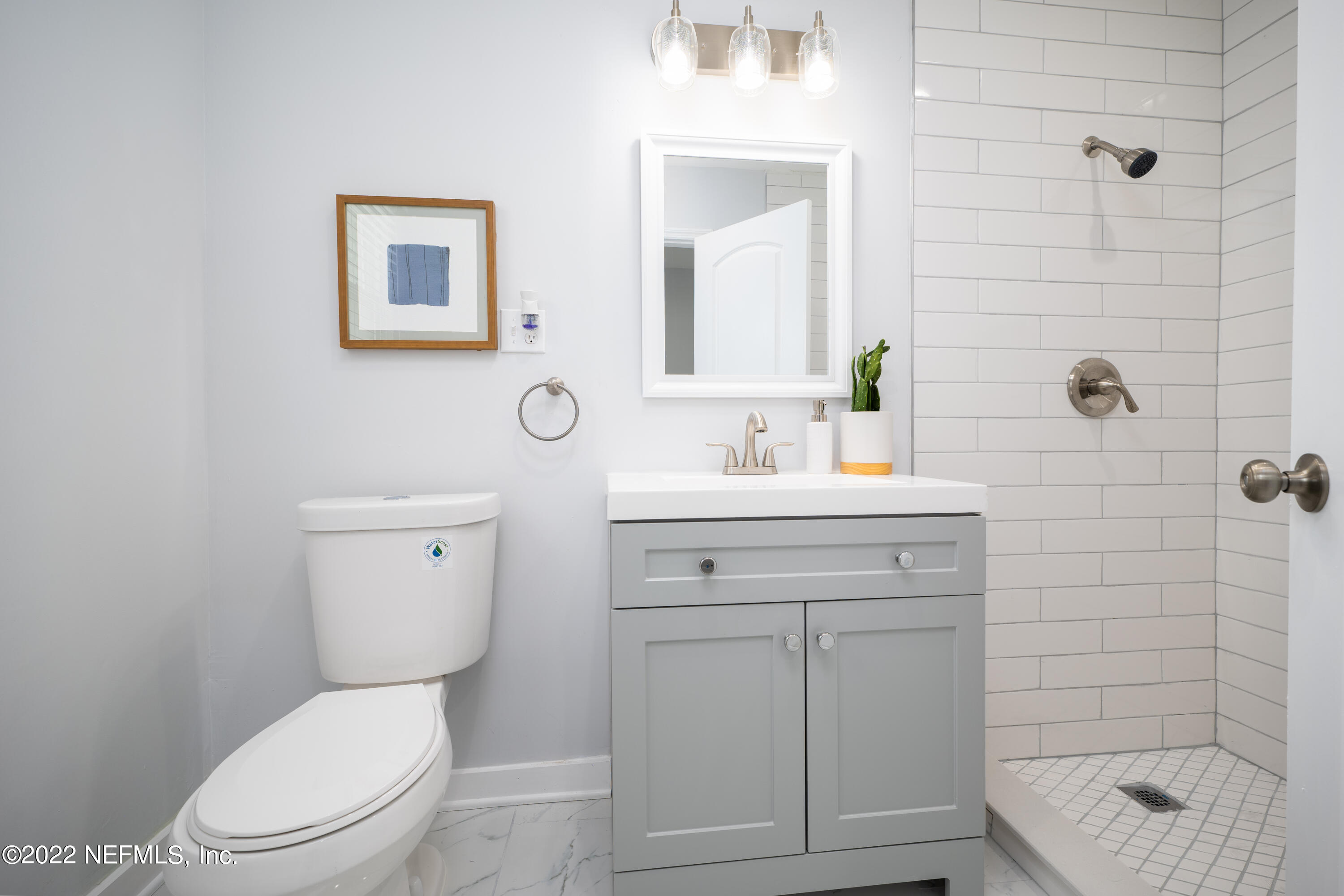 1368 Rensselaer Avenue Jacksonville, FL 32205 - Photo 22 of 48 a bathroom with a sink a toilet and shower