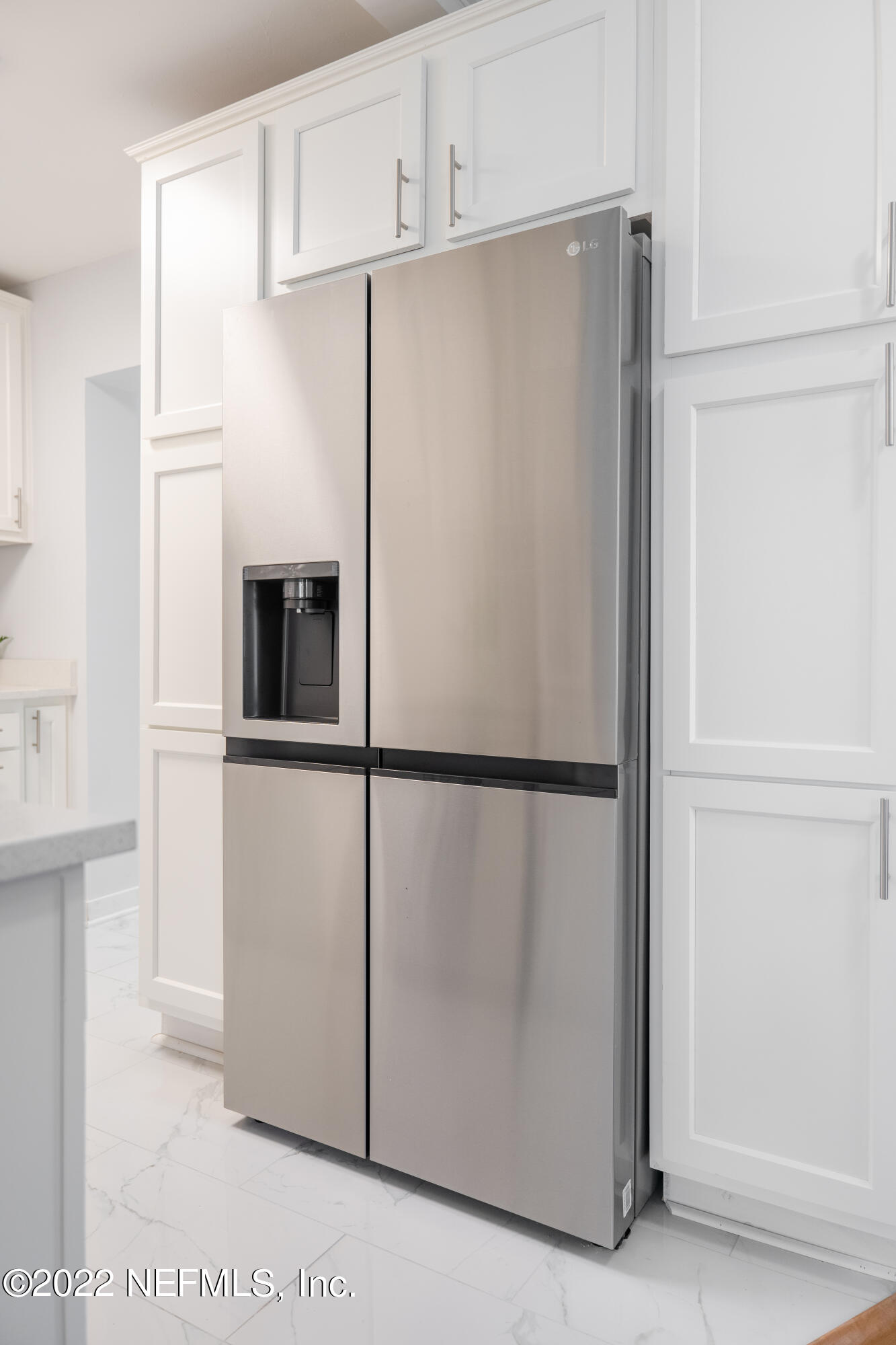 1368 Rensselaer Avenue Jacksonville, FL 32205 - Photo 41 of 48 a white refrigerator freezer sitting in a kitchen