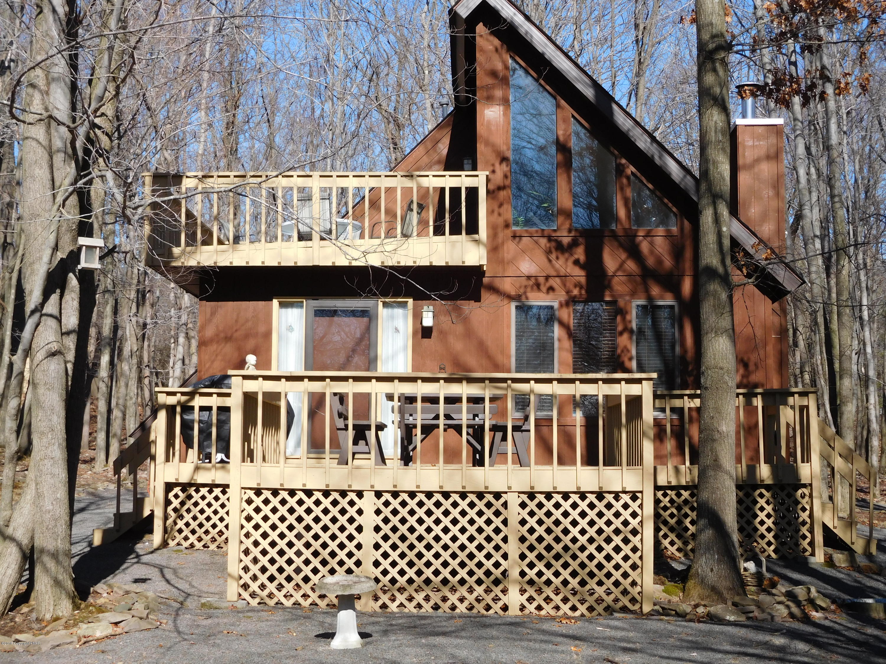 153 Maple Road Blakeslee, PA 18610 - Photo 1 of 32 a view of a house with wooden deck