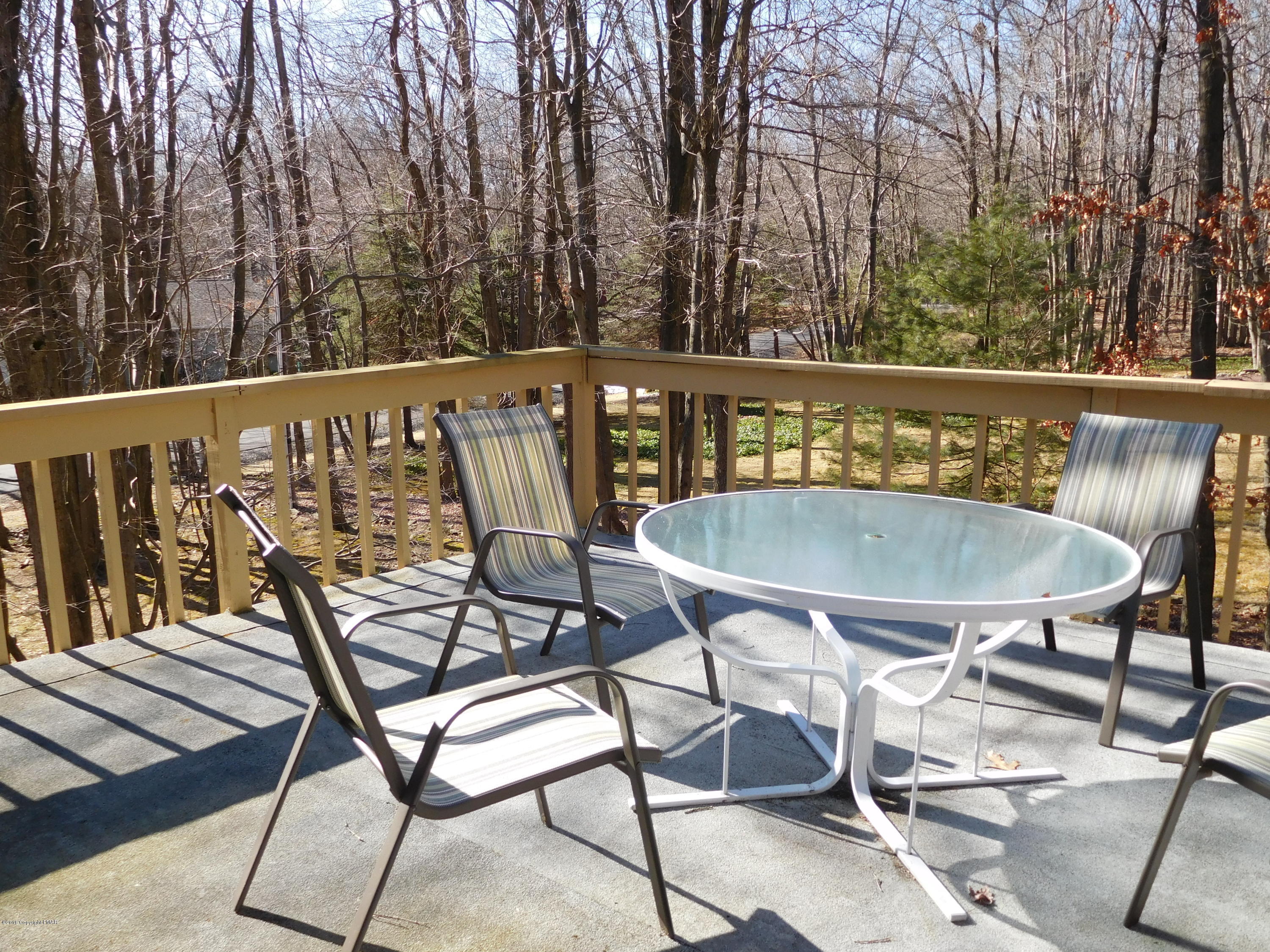 153 Maple Road Blakeslee, PA 18610 - Photo 21 of 32 a view of a chairs and table on the deck