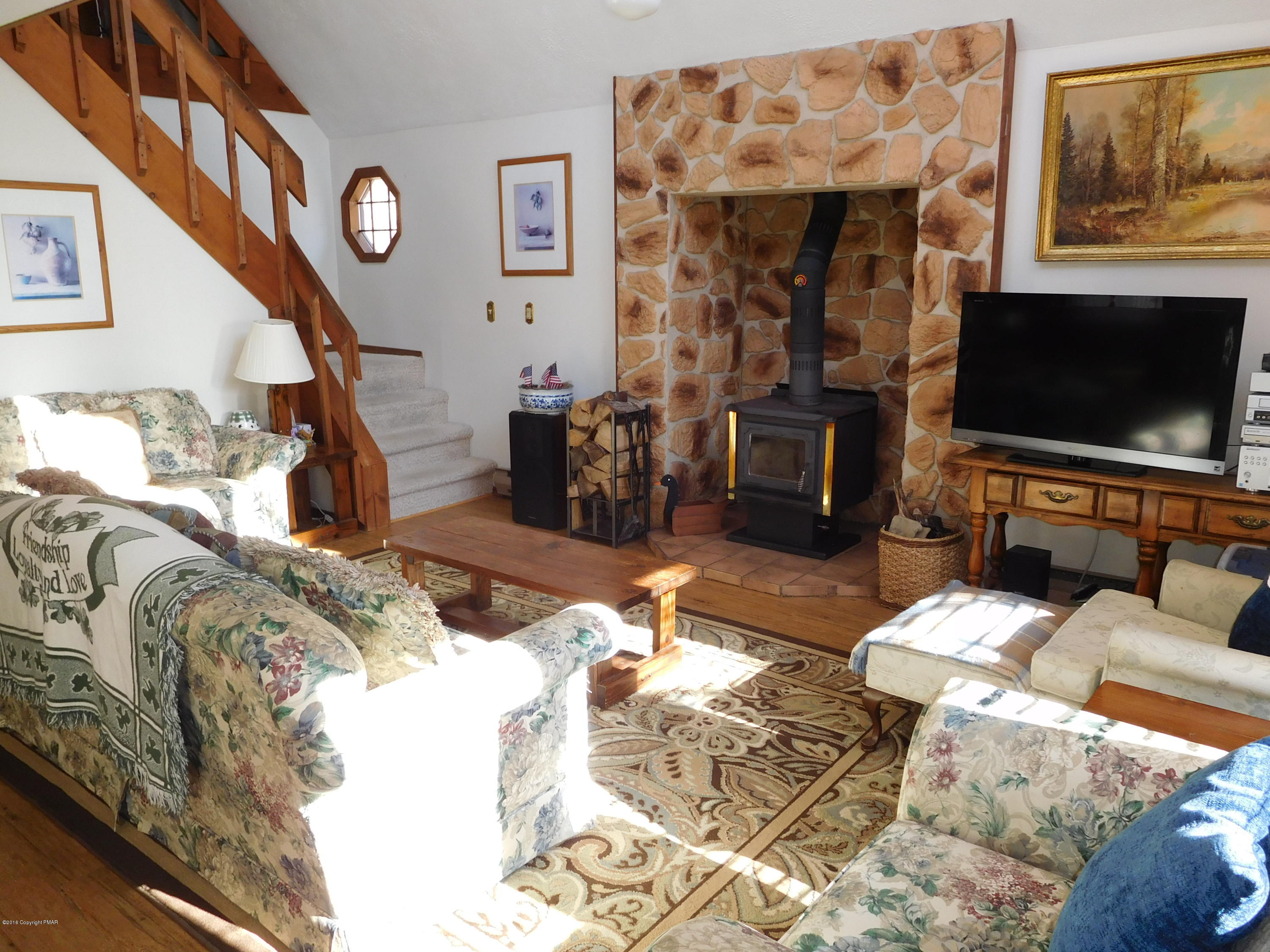 153 Maple Road Blakeslee, PA 18610 - Photo 5 of 32 a living room with furniture and a flat screen tv