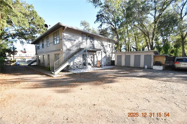 a view of a house with snow on the road