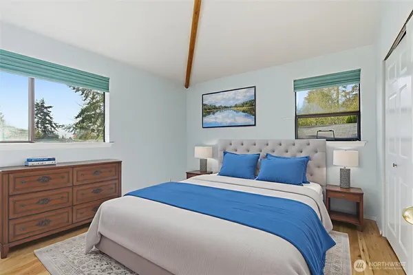 a bedroom with a bed and a dresser