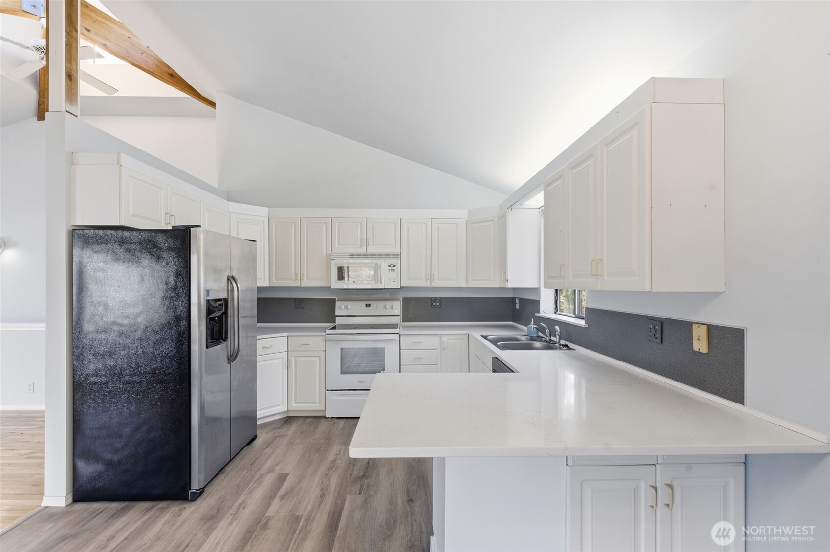 80 Brook Place Tahuya, WA 98588 - Photo 23 of 40 a kitchen with stainless steel appliances a refrigerator sink and cabinets