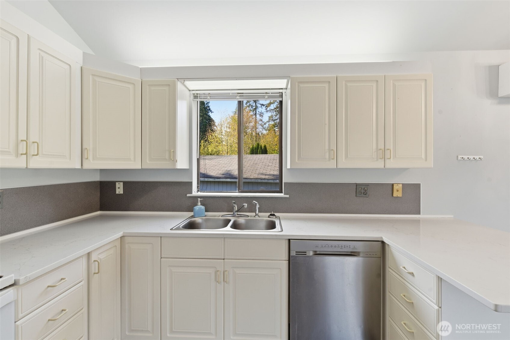 80 Brook Place Tahuya, WA 98588 - Photo 24 of 40 a kitchen with a sink cabinets and window