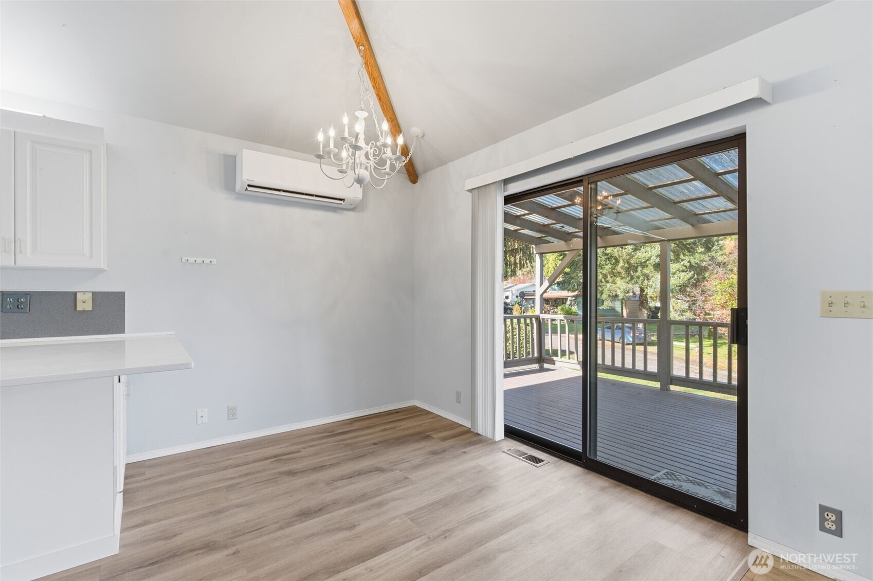 80 Brook Place Tahuya, WA 98588 - Photo 26 of 40 a view of an empty room with wooden floor and a window