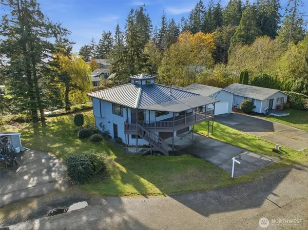 an aerial view of a house with a big yard