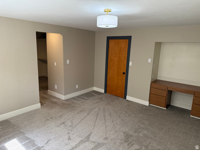 15 West 1600th Street South Mapleton, UT 84664 - Photo 16 of 22 Spacious room featuring gray carpet, light tan walls, and white baseboards