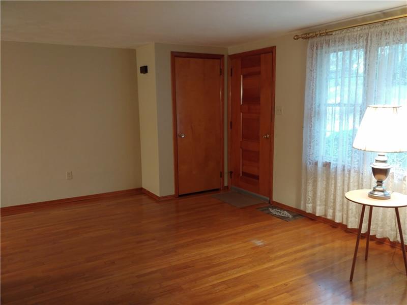 356 Middletown Road New Stanton, PA 15672 - Photo 4 of 15 Another view of the living room, entrance door, and coat closet.