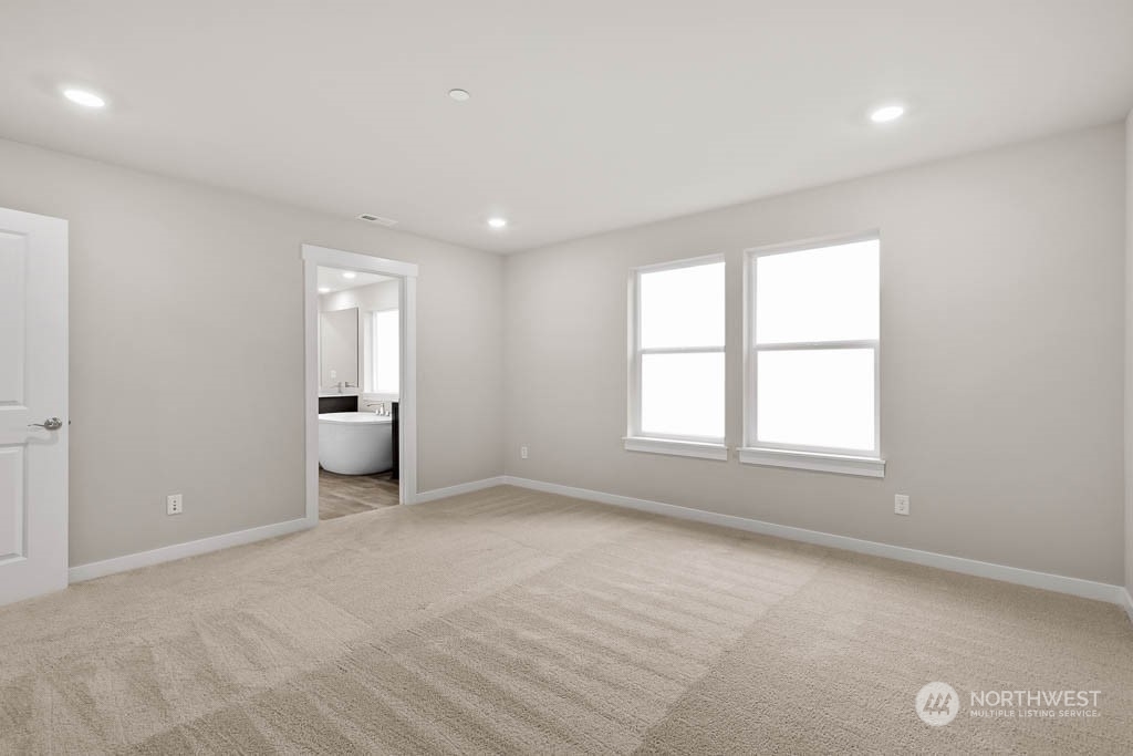 2725 193rd Place Southeast, Unit F6 Bothell, WA 98012 - Photo 25 of 35 an empty room with a bathroom and a window