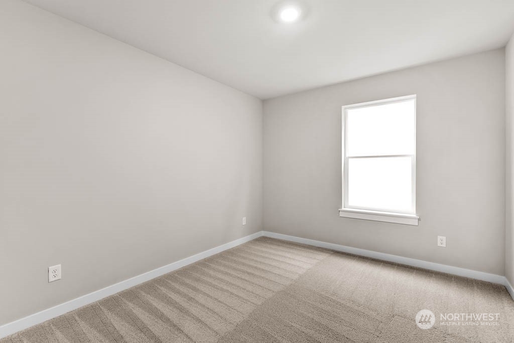 2725 193rd Place Southeast, Unit F6 Bothell, WA 98012 - Photo 31 of 35 an empty room with a window