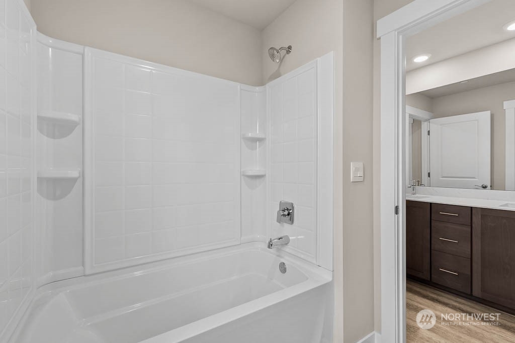 2725 193rd Place Southeast, Unit F6 Bothell, WA 98012 - Photo 33 of 35 a bathroom with a bathtub and a sink