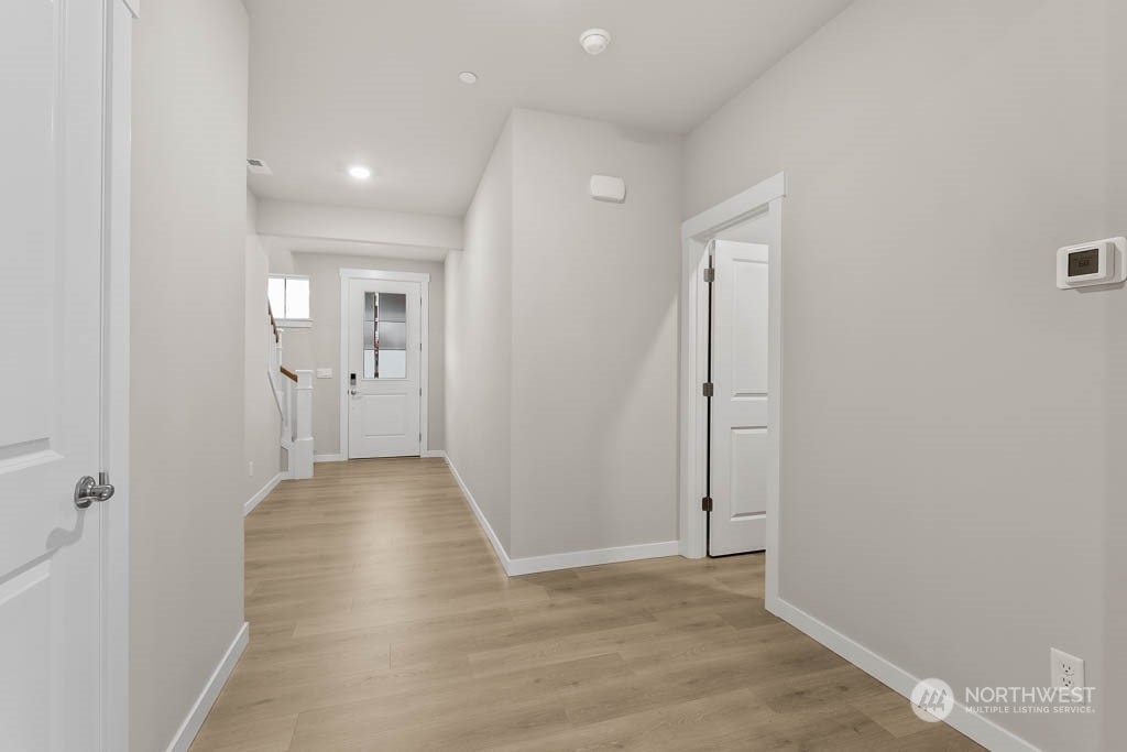 2725 193rd Place Southeast, Unit F6 Bothell, WA 98012 - Photo 5 of 35 wooden floor with a bathroom