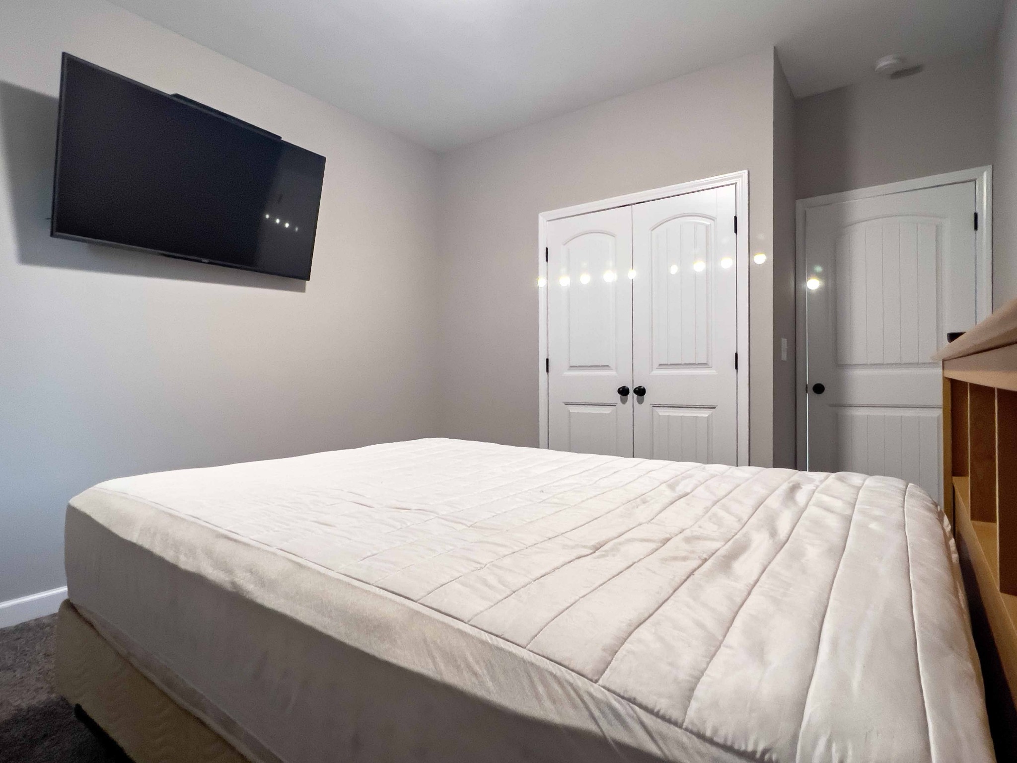 1239 Oak Grove Road Dickson, TN 37055 - Photo 37 of 54 a bedroom with a bed and a flat tv screen on dresser