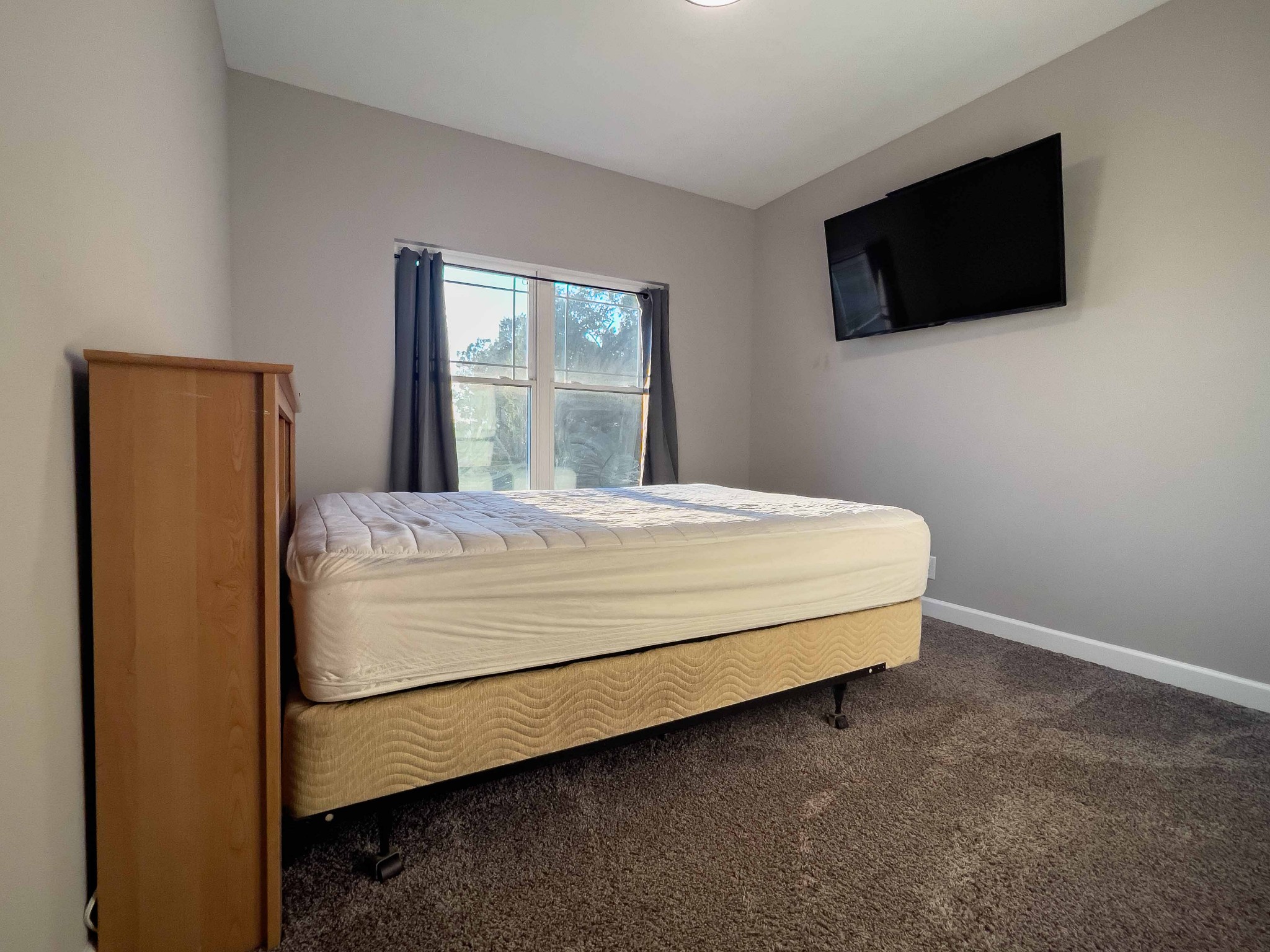 1239 Oak Grove Road Dickson, TN 37055 - Photo 38 of 54 a bedroom with a bed and a flat screen tv