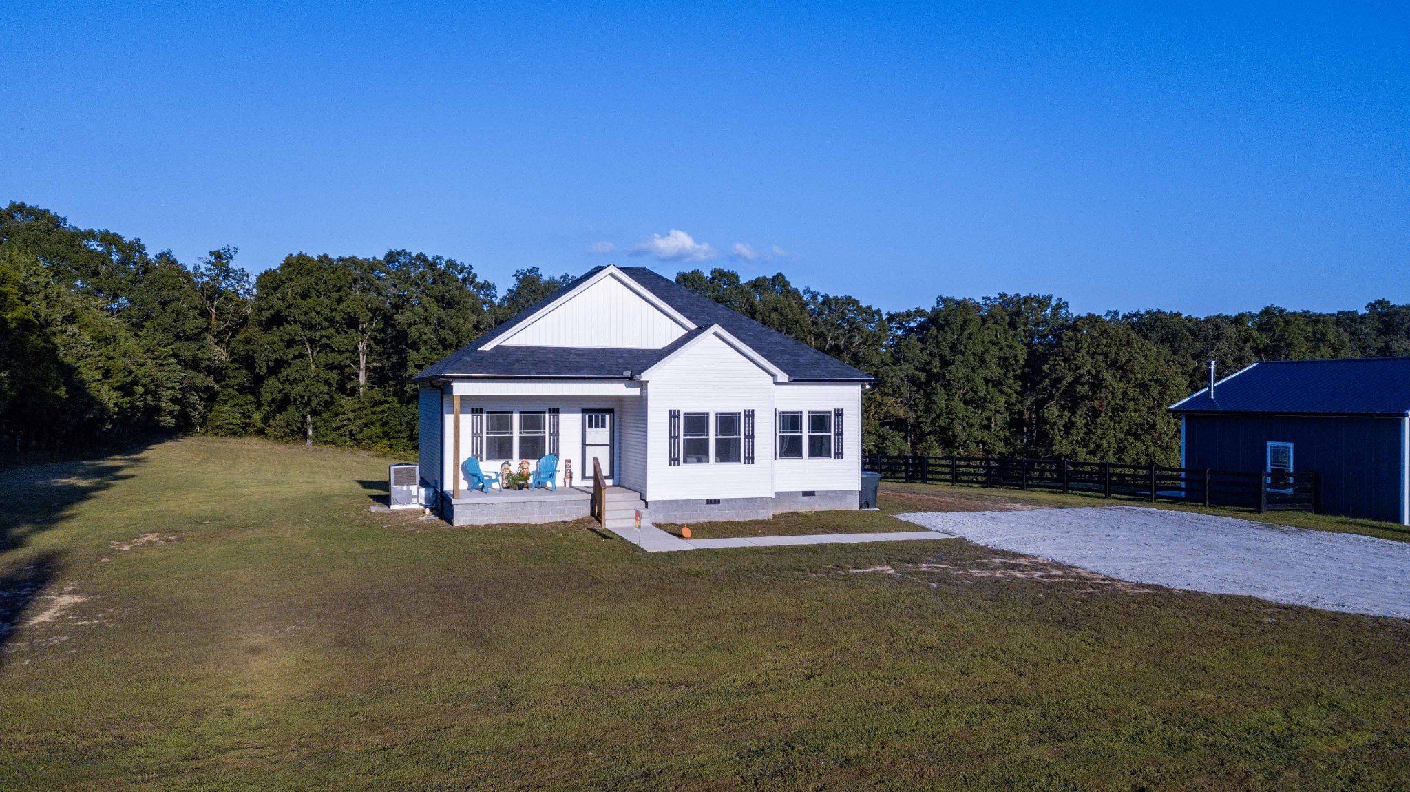 1239 Oak Grove Road Dickson, TN 37055 - Photo 5 of 54 a house with trees in the background
